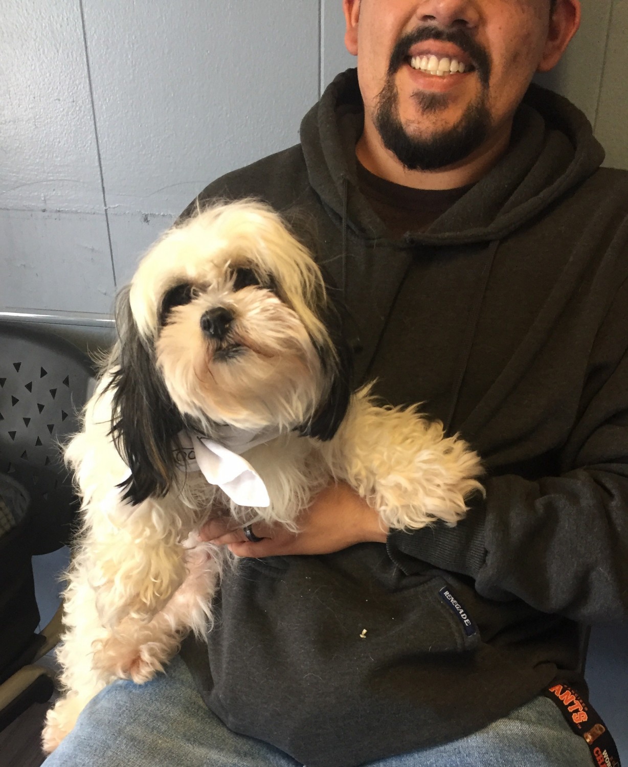 Man holding fluffy dog